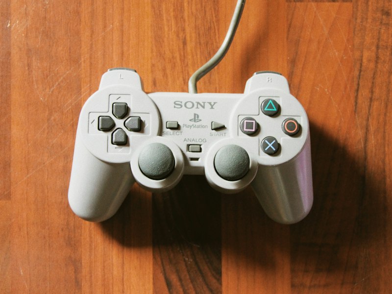 Reviewer's controller resting on notes